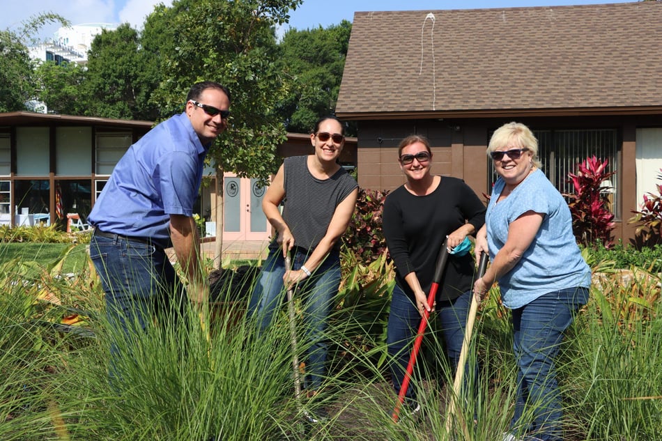 S-One Plants Tree at Bay Park Conservatory